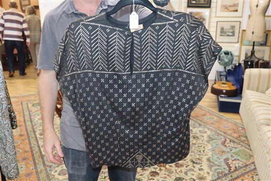 An Egyptian metal and net top and a black all-in-one trousers (2)